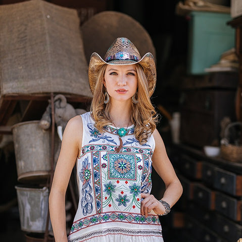model wearing cowgirl hat with turquoise inlays