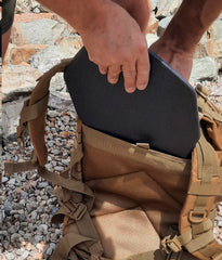 Plate being inserted into Armed AF tactical pack
