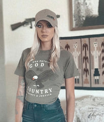 Patriotic woman in Armed AF hat and tee shirt