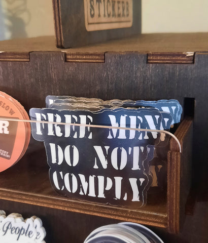 Free men do not comply sticker in gift shop display