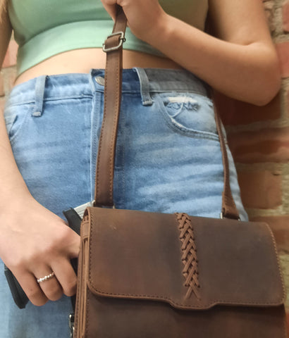 leather gun purse on model with pistol
