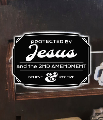 Protected by Jesus and second amendment sticker closeup