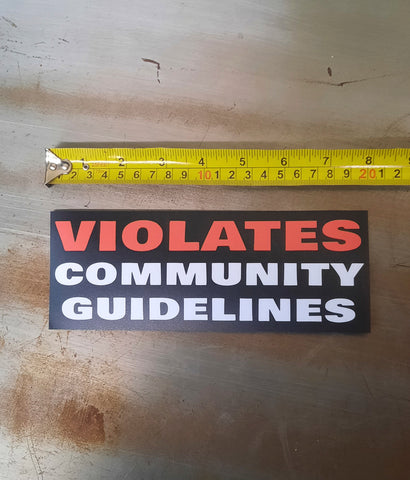 violates community guidelines sticker next to ruler