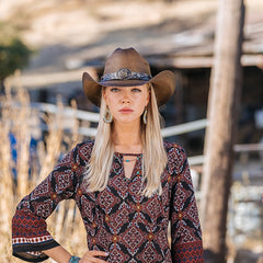 Model wearing ladies cowboy hat with horse buckle