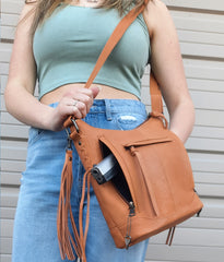 caramel leather gun purse on model
