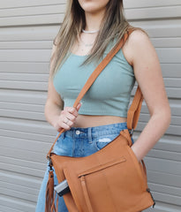 model with soft leather hand bag